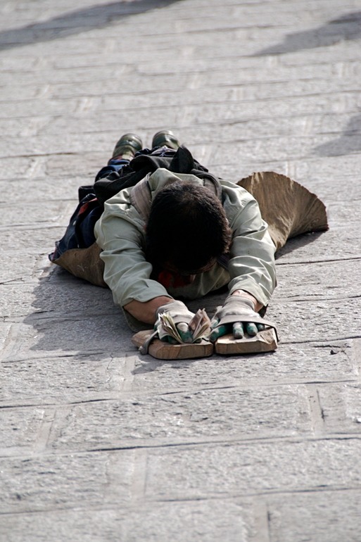 Pilgram Prostrate with money